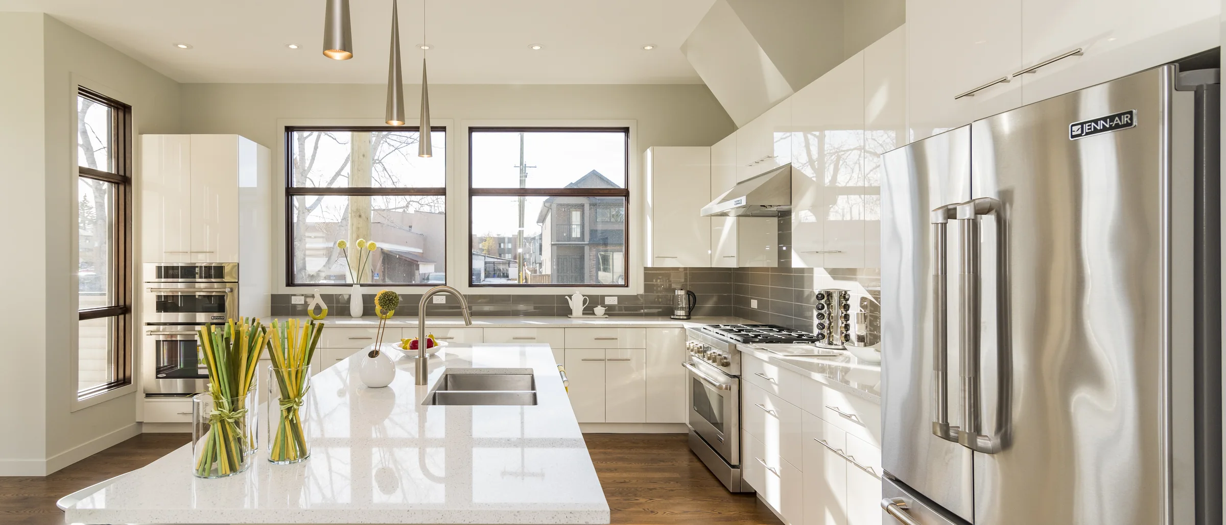 Bright kitchen with a clean island and stainless steel appliances